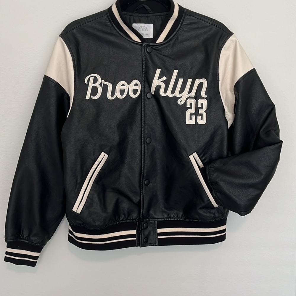 Zara jersey jacket, in a black and tan color. The size is a 13-14 (size small). - Picture 2 of 7